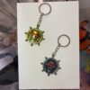 Straw Hat Emblem One Piece keychain golden and silver collectible anime accessory kaizoq anime merc, kaizoku realm anime store uganda