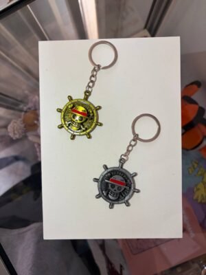 Straw Hat Emblem One Piece keychain golden and silver collectible anime accessory kaizoq anime merc, kaizoku realm anime store uganda