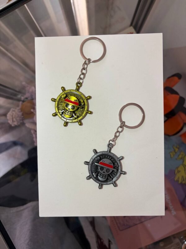 Straw Hat Emblem One Piece keychain golden and silver collectible anime accessory kaizoq anime merc, kaizoku realm anime store uganda