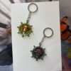 Straw Hat Emblem One Piece keychain golden and silver collectible anime accessory kaizoq anime merc, kaizoku realm anime store uganda