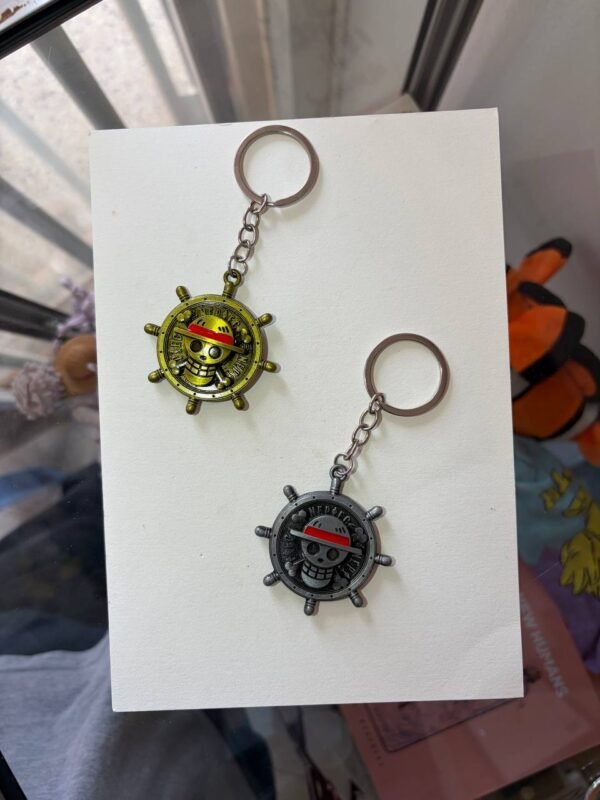 Straw Hat Emblem One Piece keychain golden and silver collectible anime accessory kaizoq anime merc, kaizoku realm anime store uganda