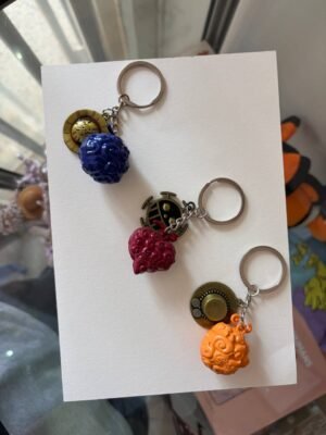 Gum-Gum Fruit, Flame-Flame Fruit, Op-Op Fruit key chains, i plan to set then as a variable product but all r on one photo product image