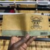 Brown Straw Hat Wallet with olive-green lining collectible anime accessory kaizoq anime merc, kaizoku realm anime store uganda